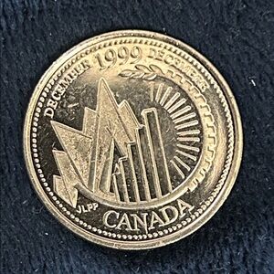 1999 Rsre Error on N & A in Canada Coin on reverse